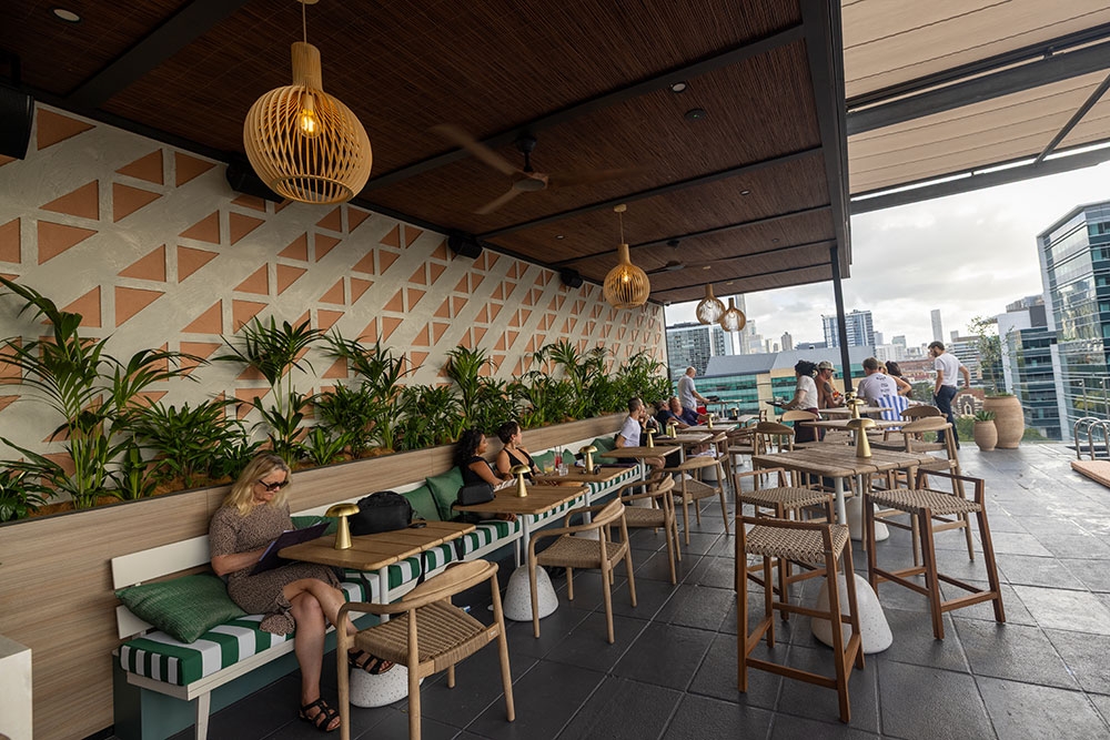 Undercover tables and chairs at Above Rooftop & bar