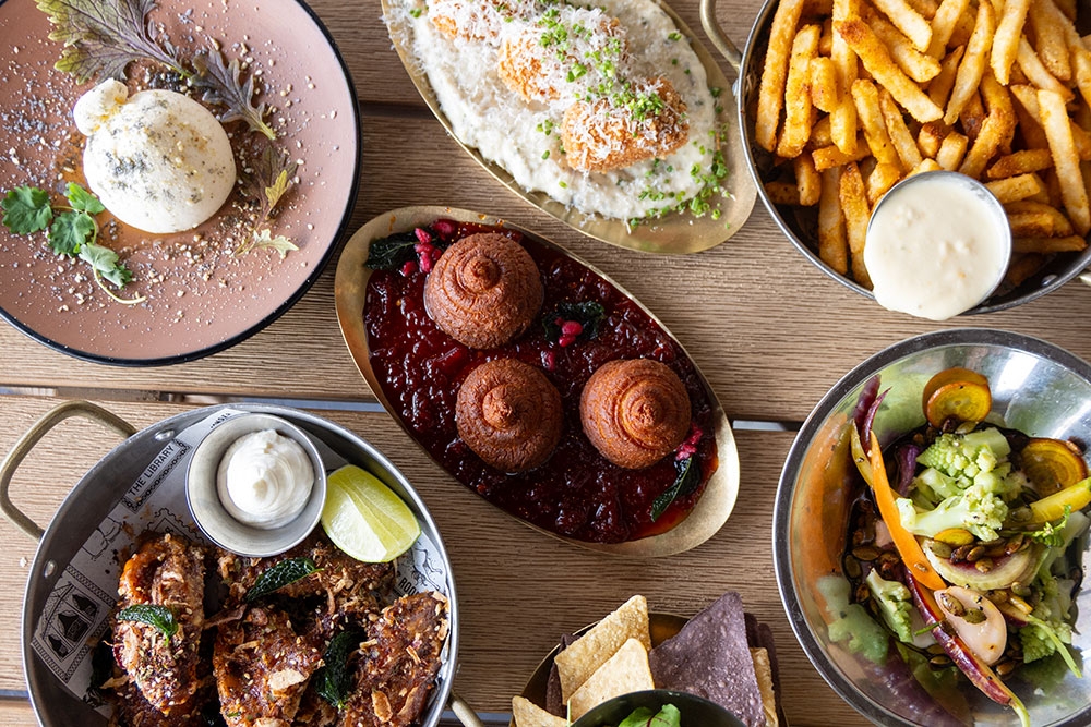 Dishes of food on table at Abover Rooftop & Bar
