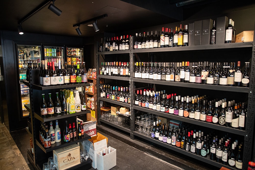 Shelves of drinks at Alfred St Bar & Bottlo