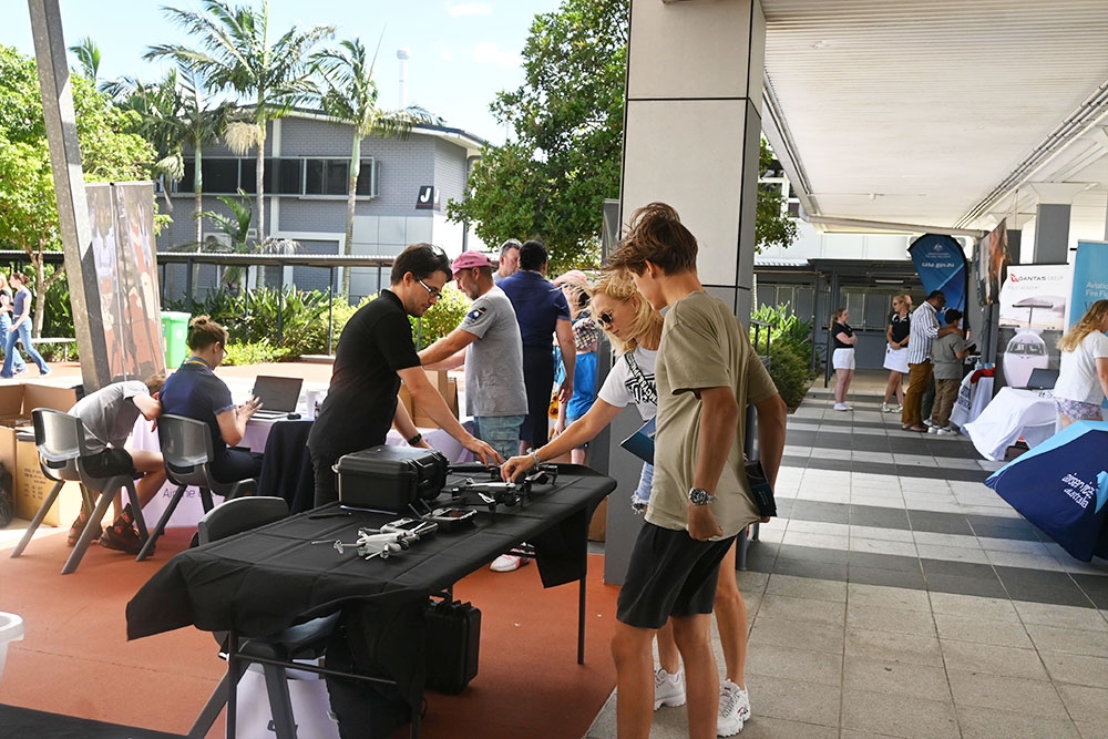 Kids taling to trainers at Aviation High School 
