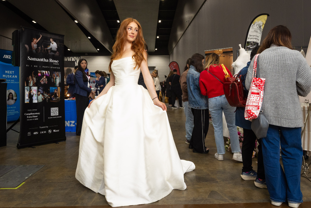 Girl posing in a wedding dress Brisbane's Annual Wedding Expo
