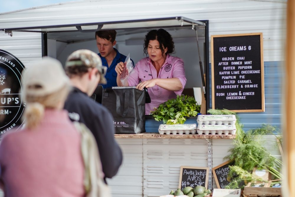 Customers lined up outside food van at the Farm Gate to City Door Christmas Market