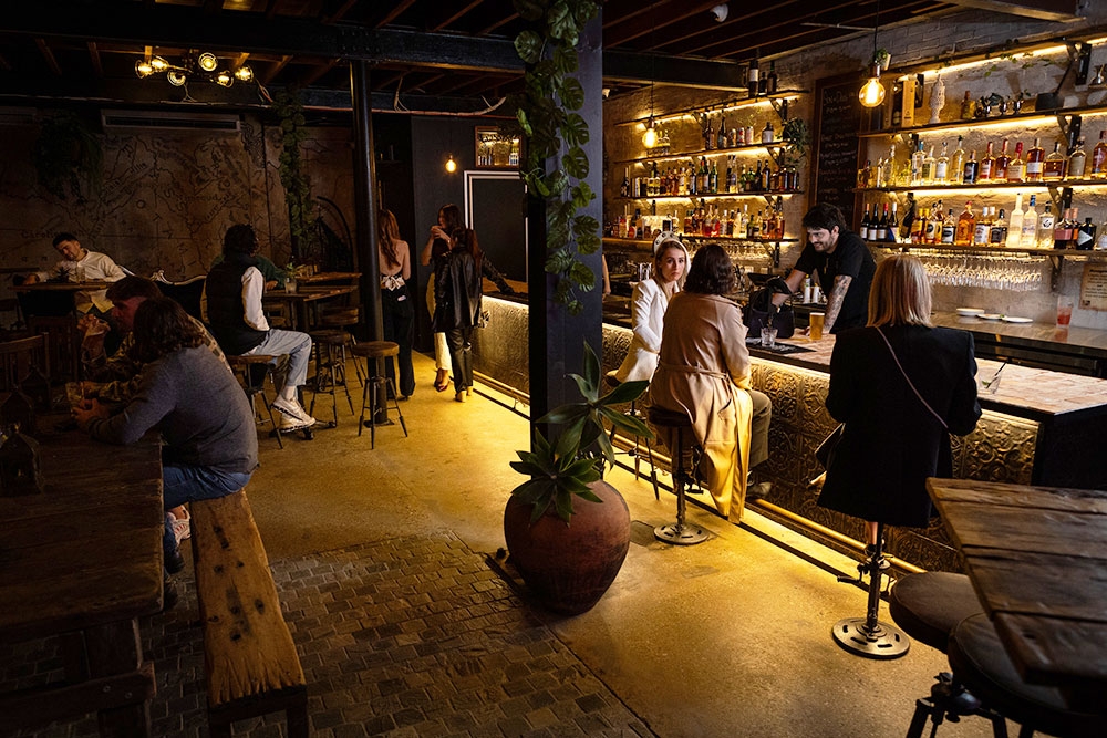 People sitting inside of Bar Mesopotamia Milton