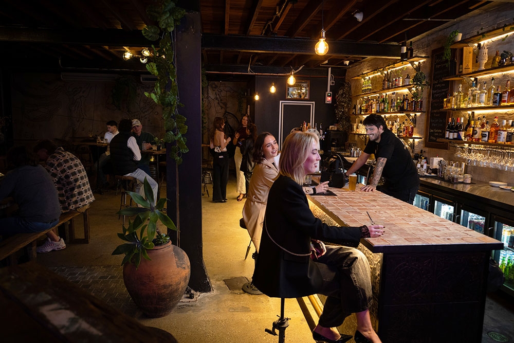 People sitting at Bar Mesopotamia Milton