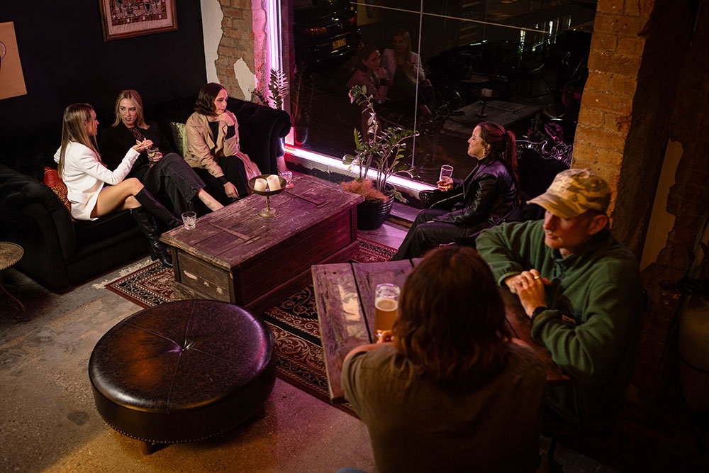 People sitting inside Bar Mesopotamia Milton