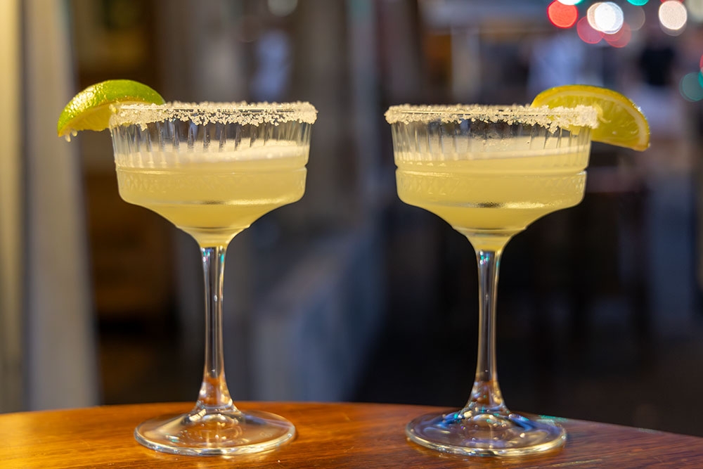 Two glasses of margarita on counter at Bar Taco