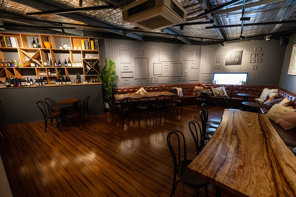 Lounge seating against a wall inside Barrels & Stills Woolloongabba