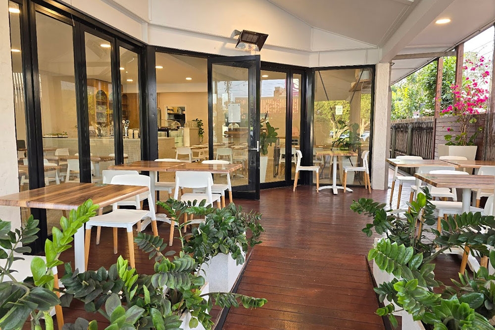 Outdoor plants and dining area at Bavarian Sizzle Coorparoo 