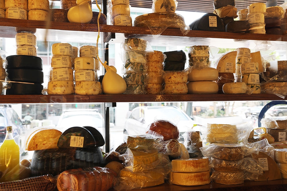 Cheese shelves at Bella Deli