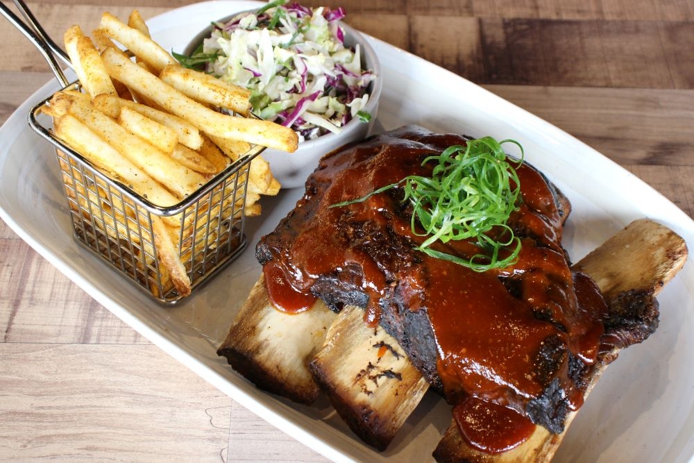Chips, meat & salad on a plate at Big Buns, Browns Plains 