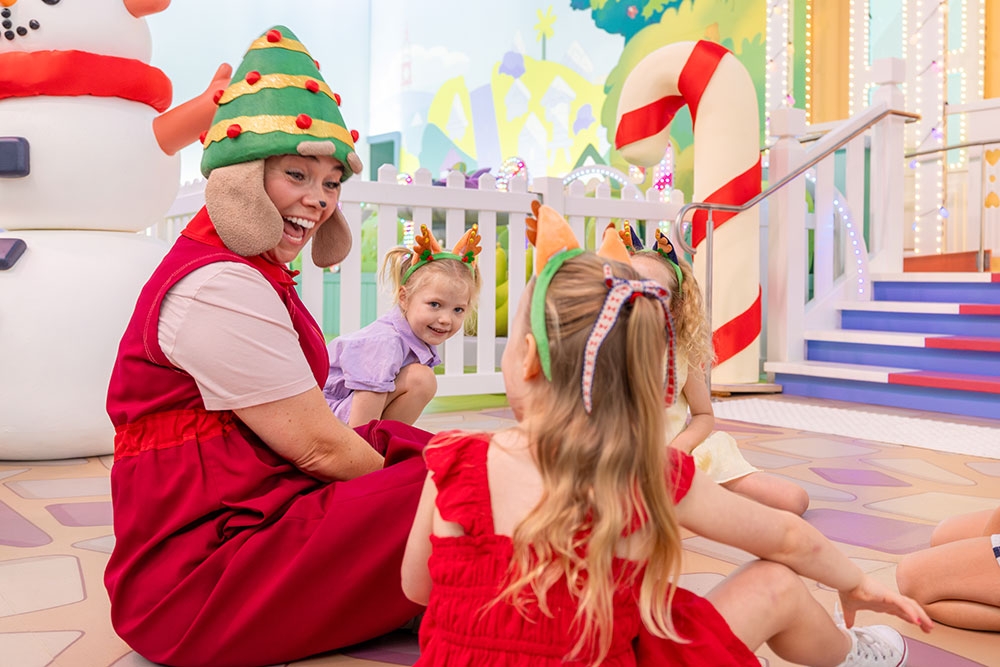 Kids sitting at steps Bluey's World