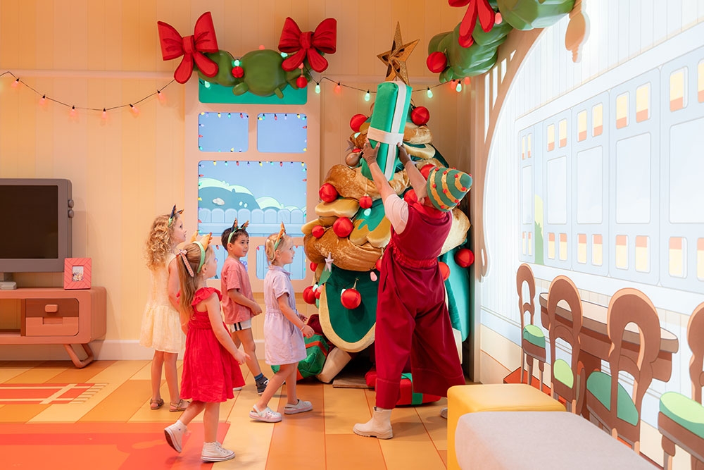kid around Christmas Tree Bluey's World