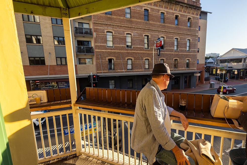 Man on balcony at Bonnie Doon Public House Fortitude Valley