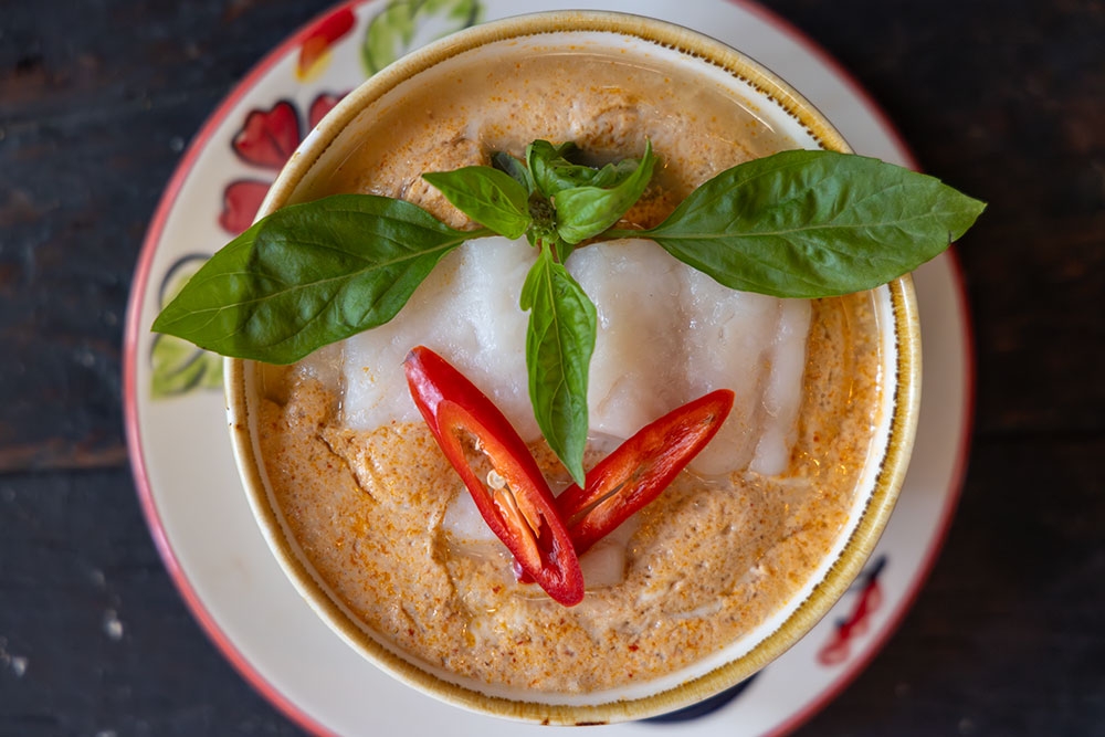 Bowl of Hor Mok Pla, a custard of river fish, freshly steamed to order with red curry paste and coconut cream at Boo's Kitchen, Woolloongabba