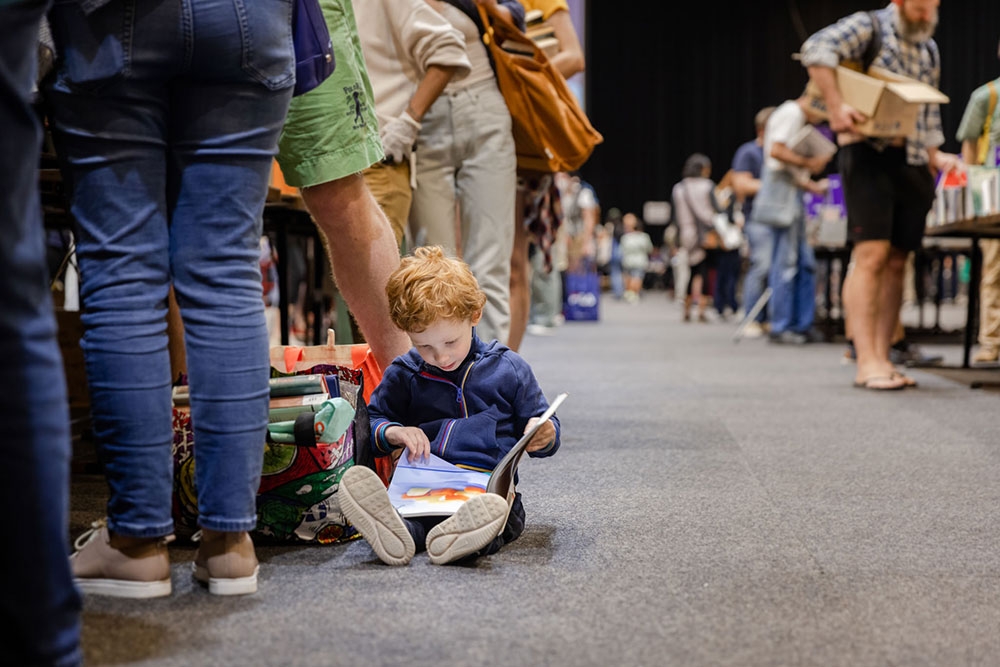 Chils with parents at UQ Alumni Book Fair