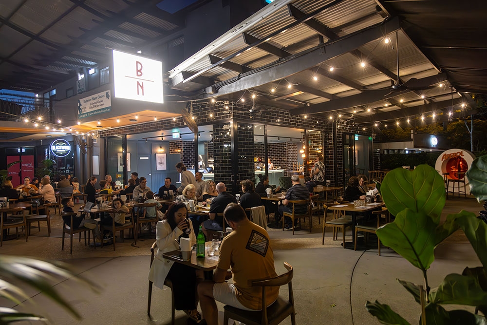People seated outside at night BoscoNero Mitchelton