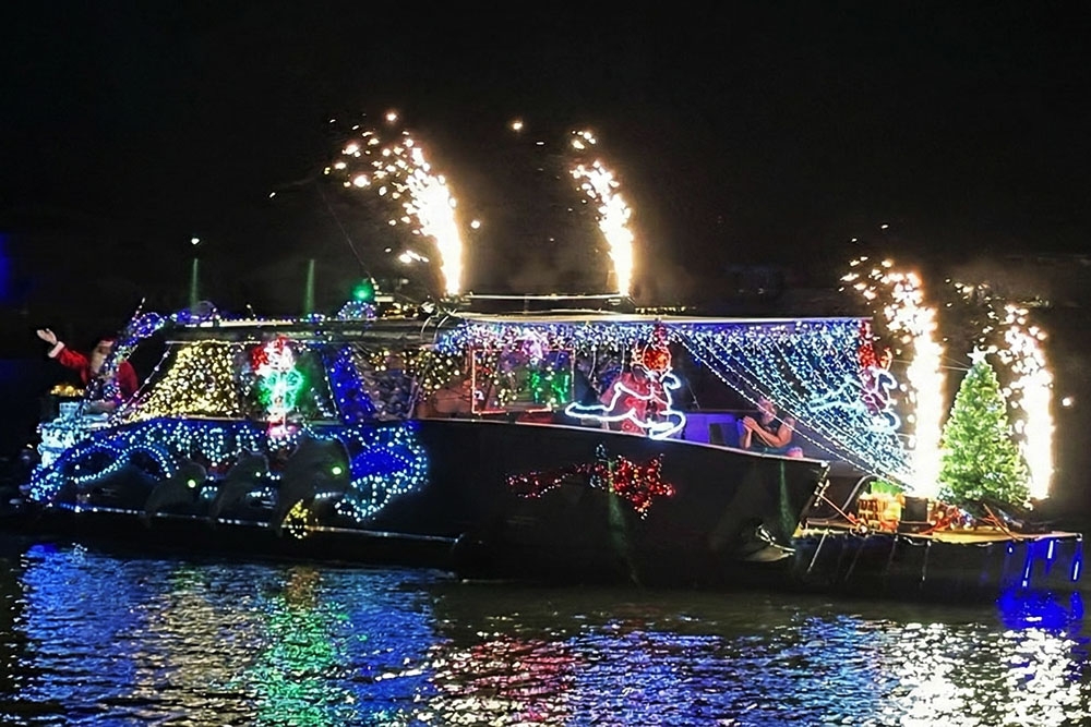 Boat lit up with Christmas lights on a Bribie Island canal