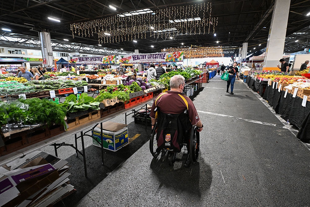 man in wheelchair Saturday Fresh Market Brisbane 
