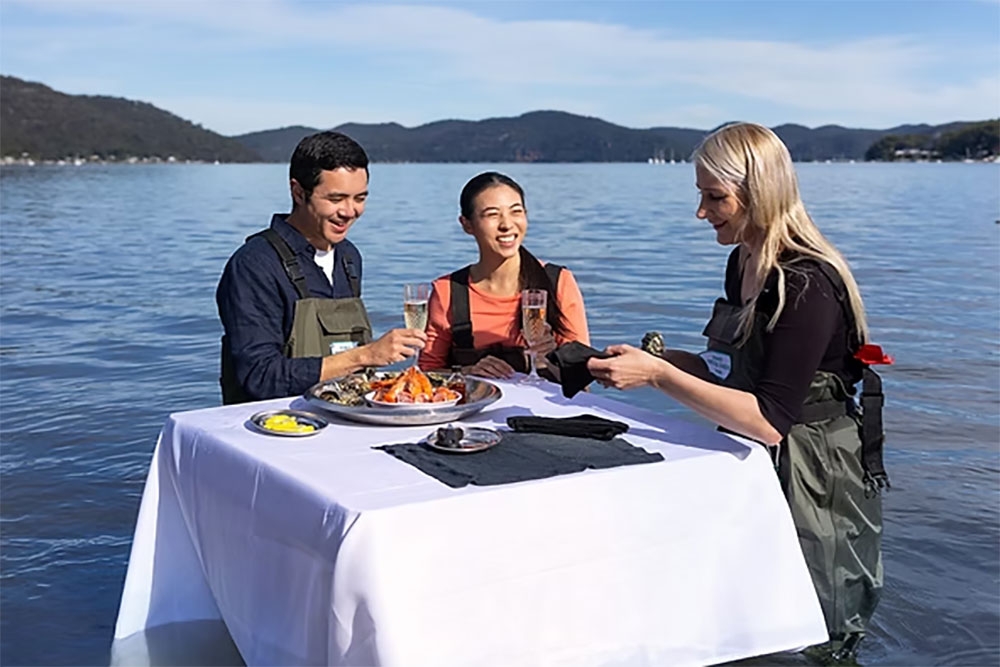 People at table in sea