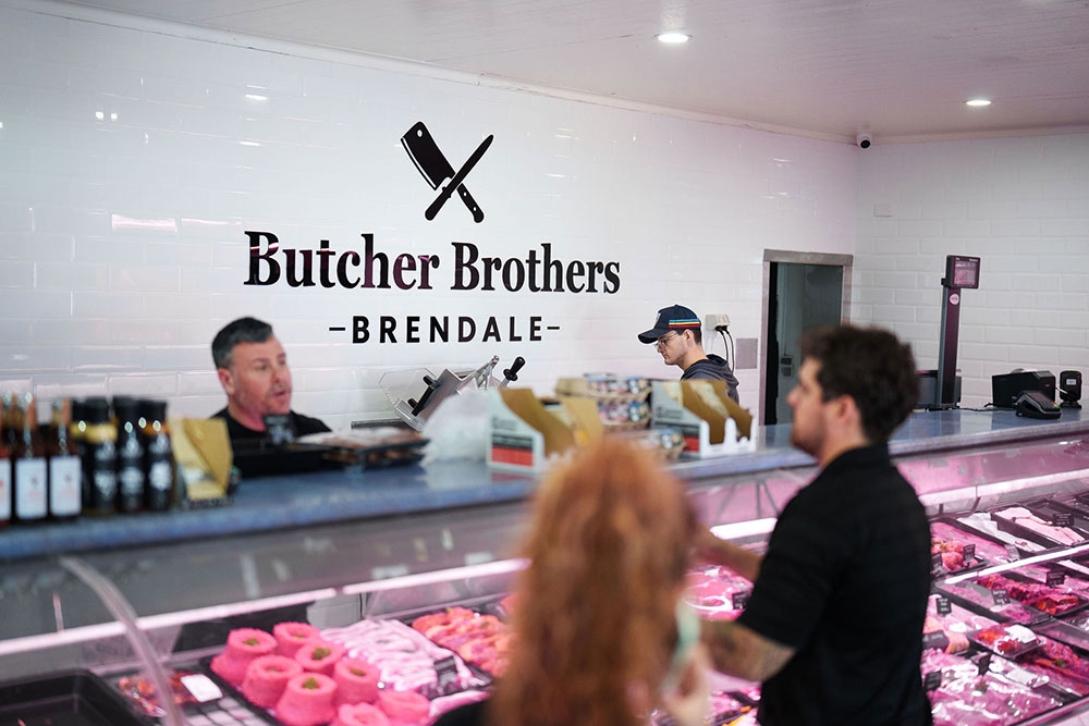 Customers at counter in Butcher Brothers