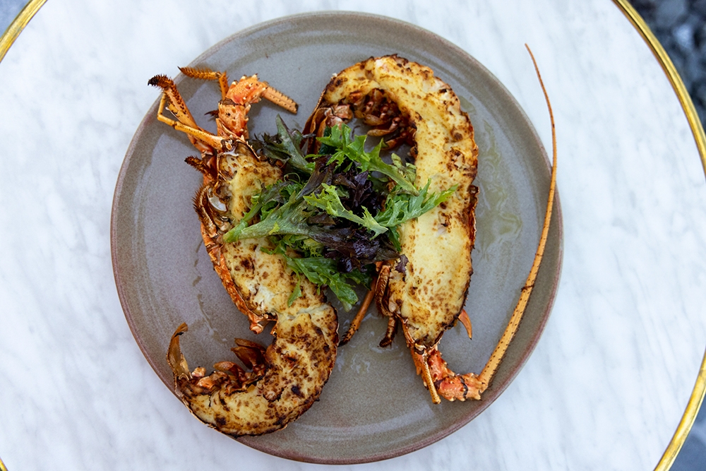 Two lobsters on a plate at Lina Rooftop, South Brisbane 