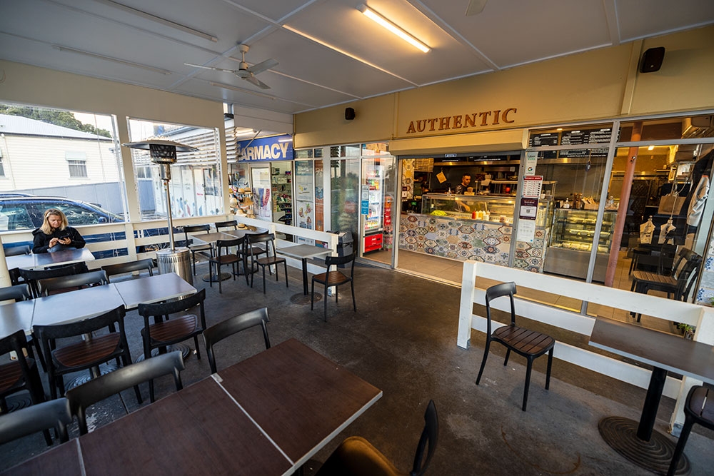 Woman sitting at table outside Authentic CharGrill & Kebab Turkish Bardon