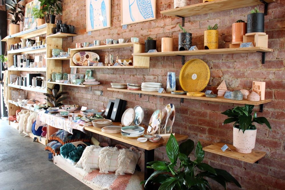 Shelves on walls stocked with products at Corn Street, Ashgrove  