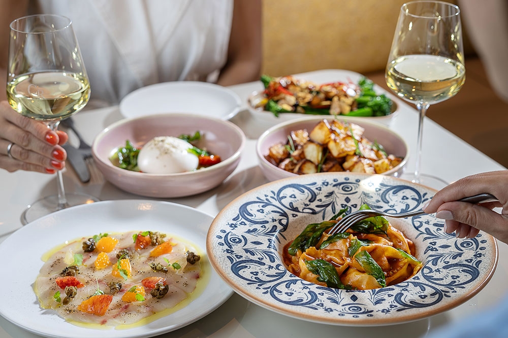 Dishes of food on table at Cucina Regina