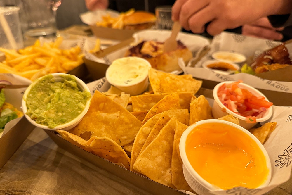 Plate of nachos with sauces in bowls at Dayboro Sugar Mill, Dayboro, Moreton Bay region, Queensland, The Mill, beers and burgers, live entertainment, cocktails, country day trips, close to Samford