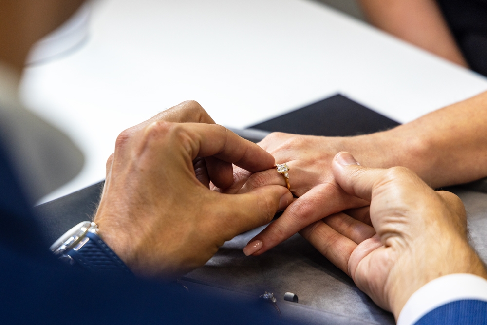 A man putting a diamond ring on a woman, Diamondport Jewellers Brisbane City