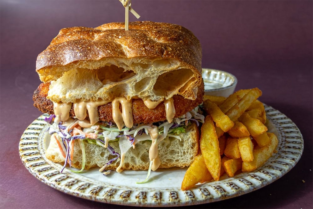 buttermilk crumbed chicken burger on a plate at Dopo Eatery Milton