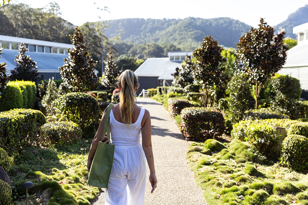 Woman walking away at Eden Health Retreat, Currumbin Valley