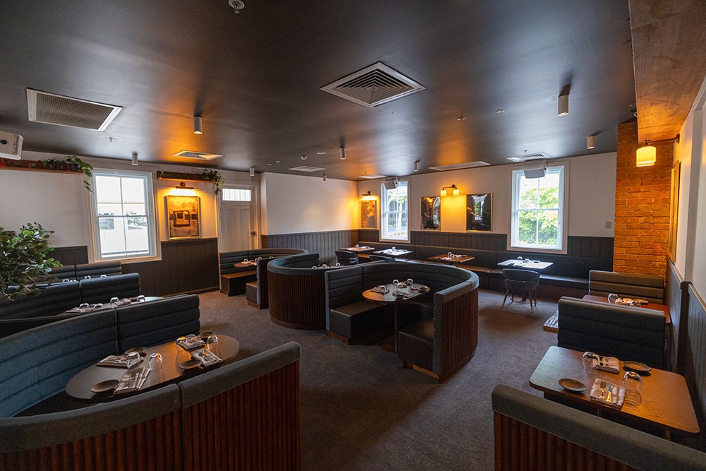 Lit up lounge dining at Ember & Ash Fortitude Valley