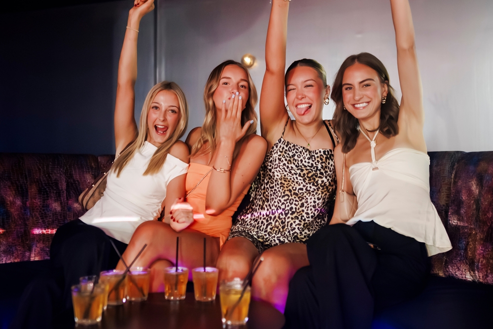 A group of girls in a booth, Enigma Functions Fortitude Valley