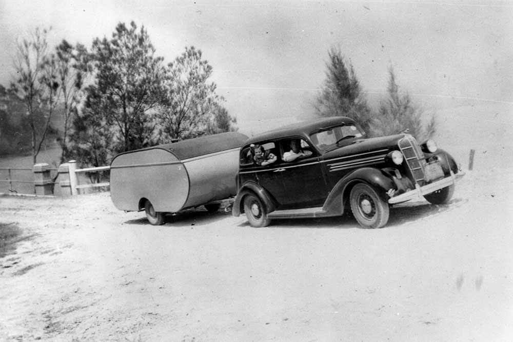 Family-holidays-in-a-1936-Dodge-with-compact-caravan_