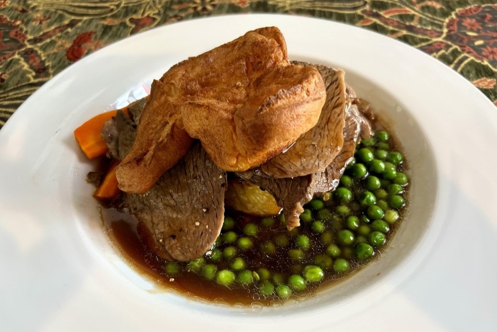 Roast meat dinner with carrots and peas in gravy at the Fox & Hounds Country Inn, Wongawallan