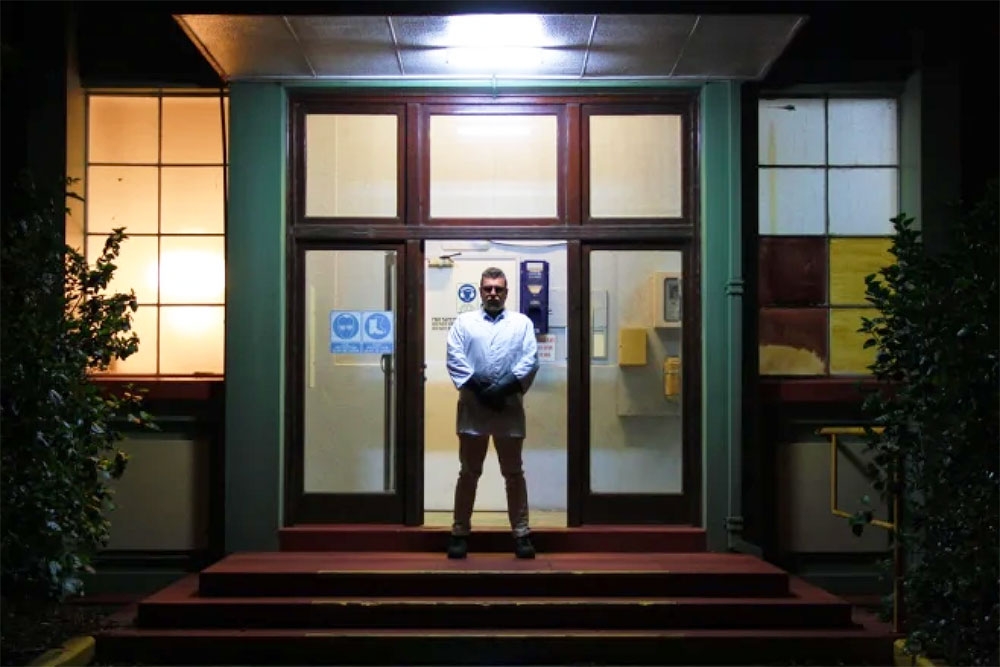 Man at entrance to Project Immersive Escape Rooms