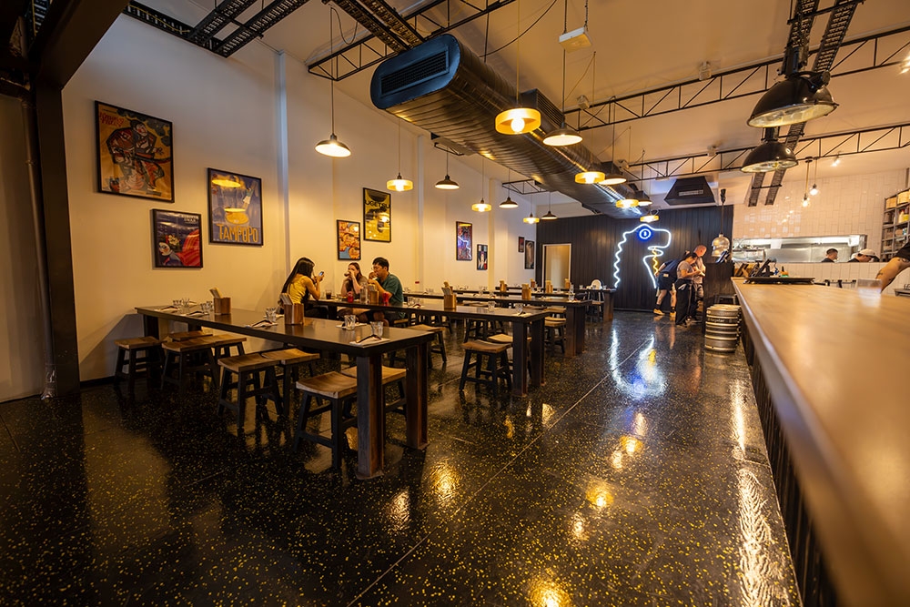 Interior space with bar on side at Hai Hai Ramen