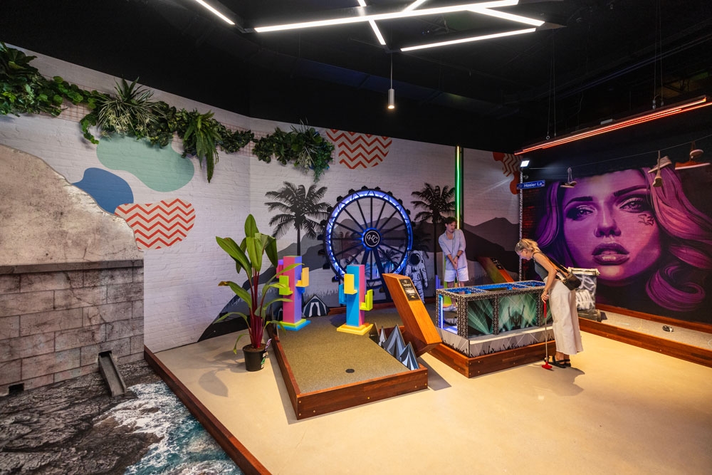 Interior of X-Golf South Bank showing a man and woman playing a game