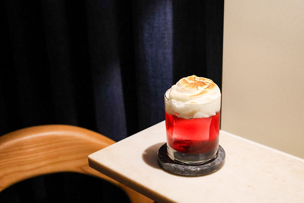 Hid Den cocktail on a table