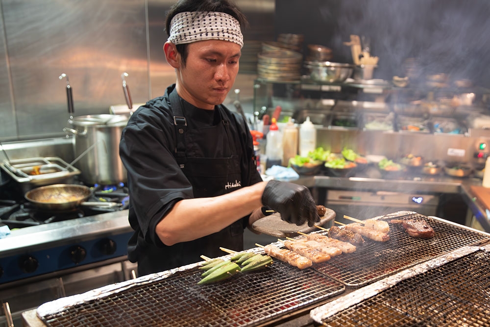 Chef in kitchen at Hideki
