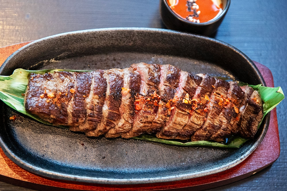 Signature sizzling steak at Hizola's Kitchen & Bar