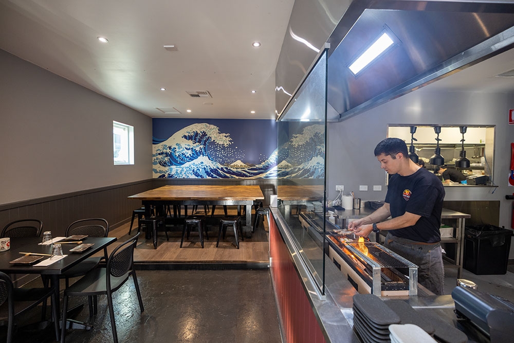 Chef in open kitchen Hono Grill Milton