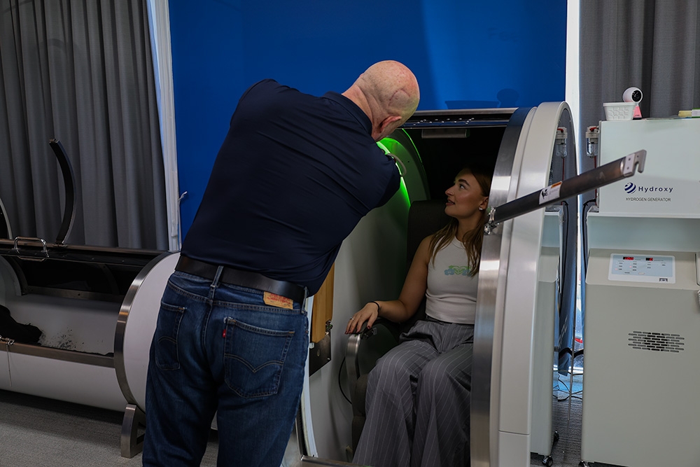 Matt helps a patient into the Hyperbaric chamber 