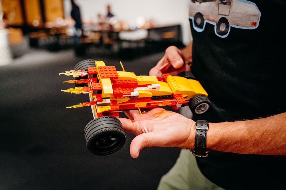 Mah holding LEGO creation
