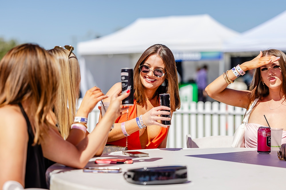 Girls drinking around a table