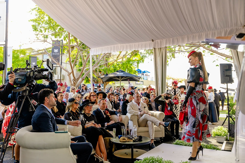 Model in front of seated crowd at the Stradbroke Season 2026