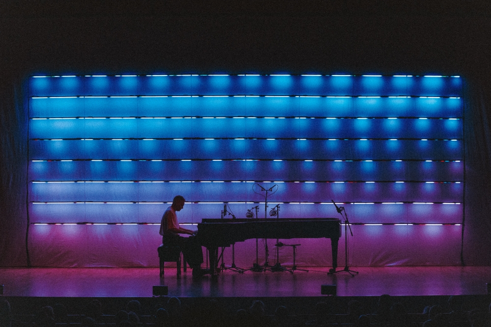 Josh Cohen blue backdrop