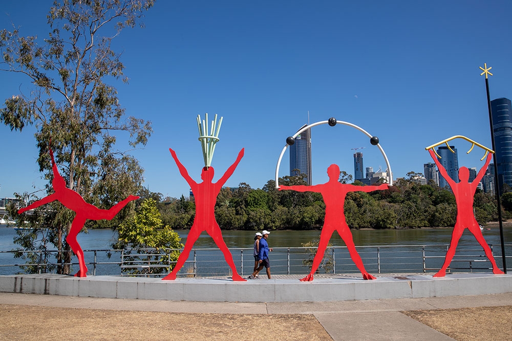 Four red human sculptures at the Kangaroo Point City Walk, Brisbane