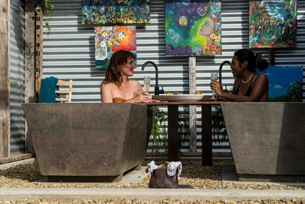 Women in bathtubs at Kin Kin Bathhouse